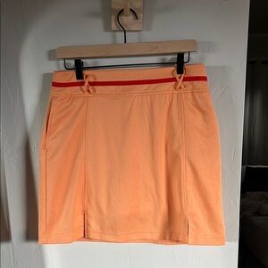 LBH skort Orange with Red‎ Accents. Pocket on side and back.
